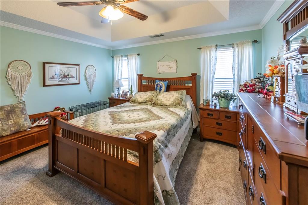 170 Baskin Road Temple, GA 30179 - Photo 17 of 34 a bedroom with a bed and a chandelier