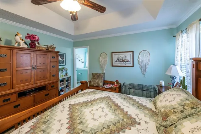 a bed room with a bed and a television