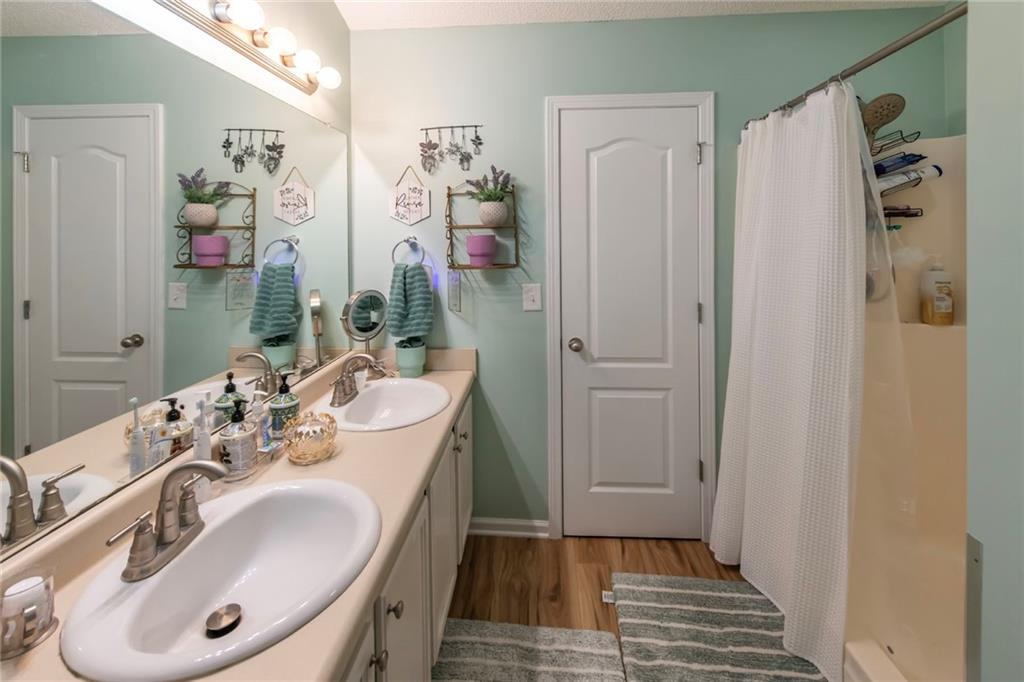170 Baskin Road Temple, GA 30179 - Photo 22 of 34 a bathroom with a sink a mirror and a shower