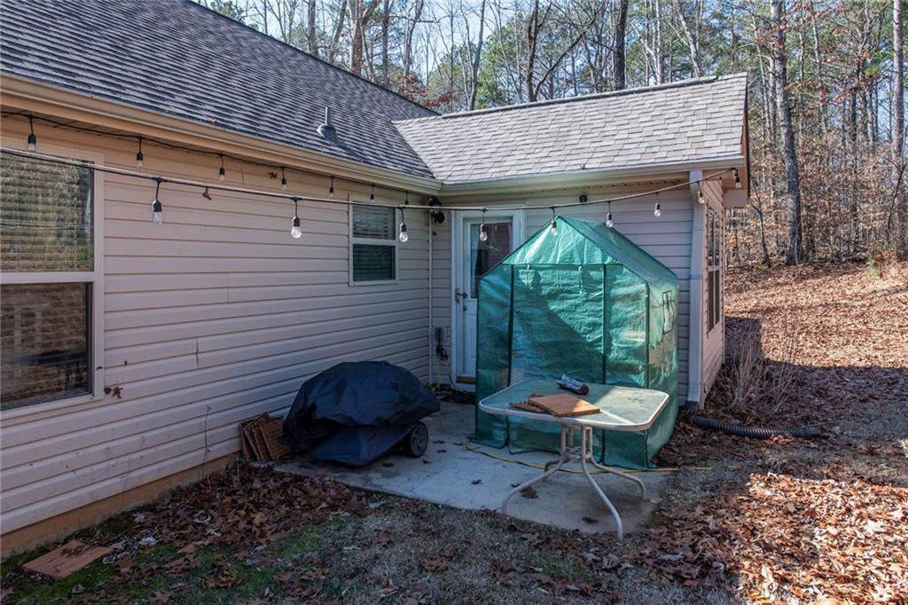 170 Baskin Road Temple, GA 30179 - Photo 27 of 34 a backyard of a house with outdoor seating