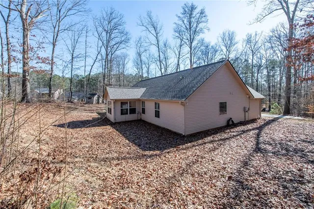 a house view with a backyard space