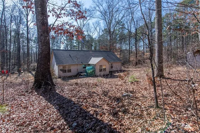 a backyard of a house with lots of green space