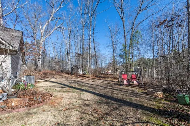 a view of street with large trees