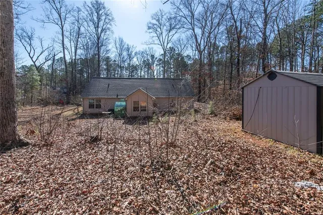 a backyard of a house with lots of green space