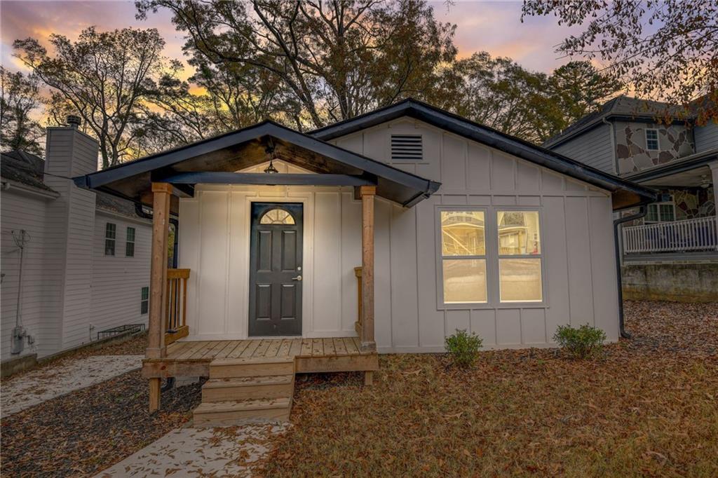 155 Hemphill School Road Northwest Atlanta, GA 30331 - Photo 1 of 1 a front view of a house with a yard