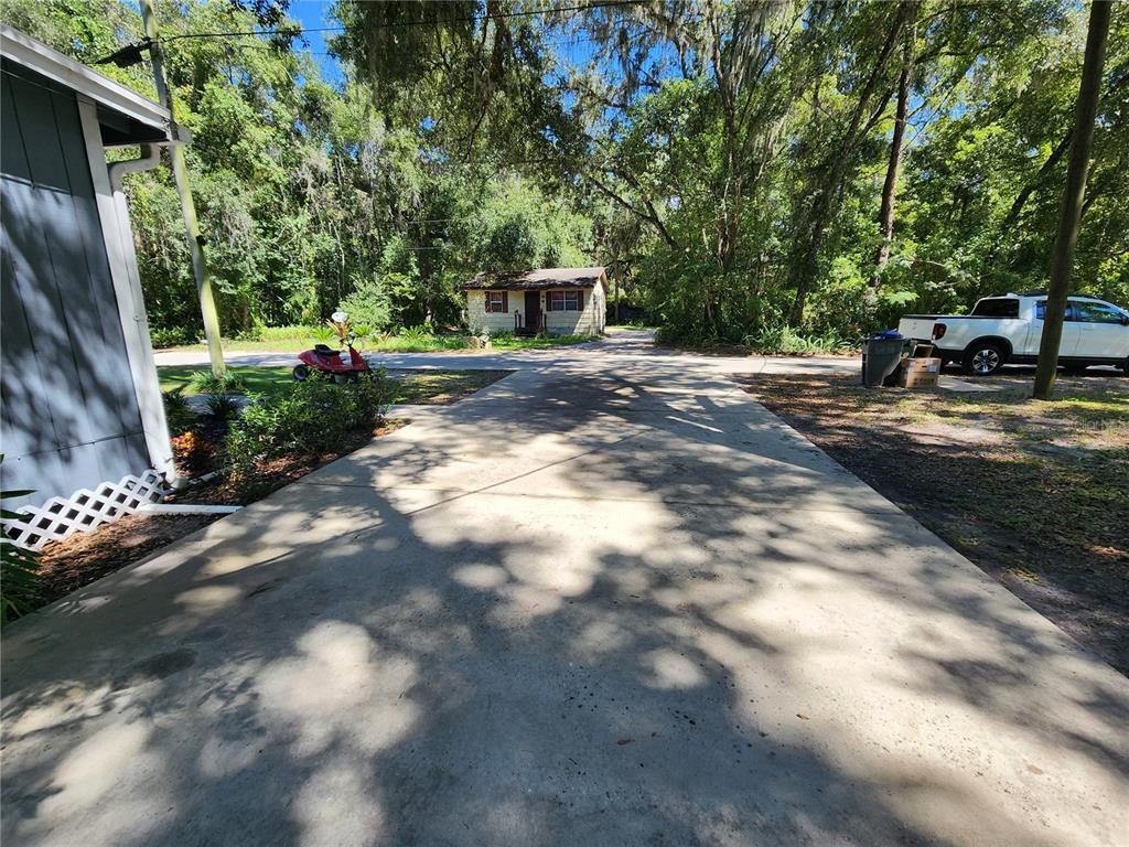 106 Southwest 6th Street Micanopy, FL 32667 - Photo 20 of 62 a view of a yard with cars
