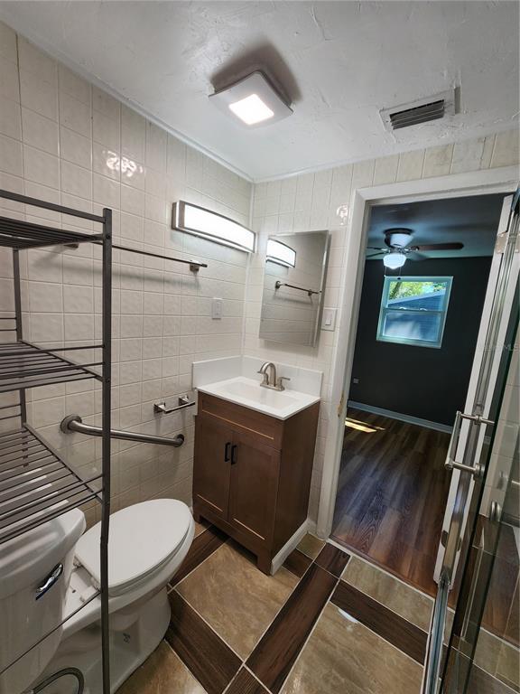 106 Southwest 6th Street Micanopy, FL 32667 - Photo 34 of 62 a bathroom with a toilet sink and mirror