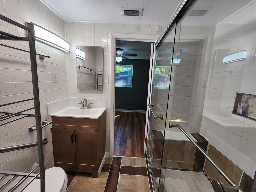 106 Southwest 6th Street Micanopy, FL 32667 - Photo 35 of 62 a bathroom with a sink and mirror