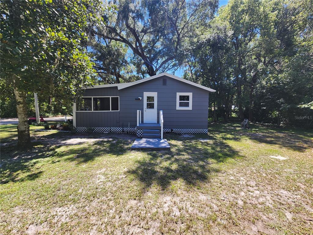 106 Southwest 6th Street Micanopy, FL 32667 - Photo 4 of 62 a view of a house with a yard