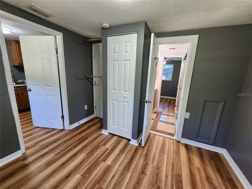 106 Southwest 6th Street Micanopy, FL 32667 - Photo 45 of 62 a view of a hallway with wooden floor and staircase