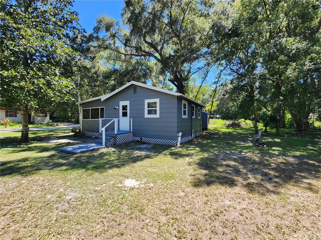 106 Southwest 6th Street Micanopy, FL 32667 - Photo 5 of 62 a view of a house with a yard