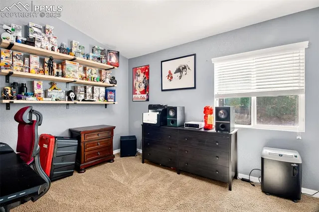 a workspace with furniture and a window