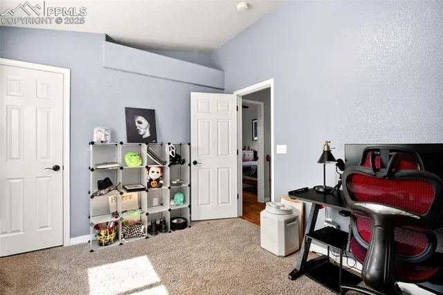 a room with furniture and musical instruments