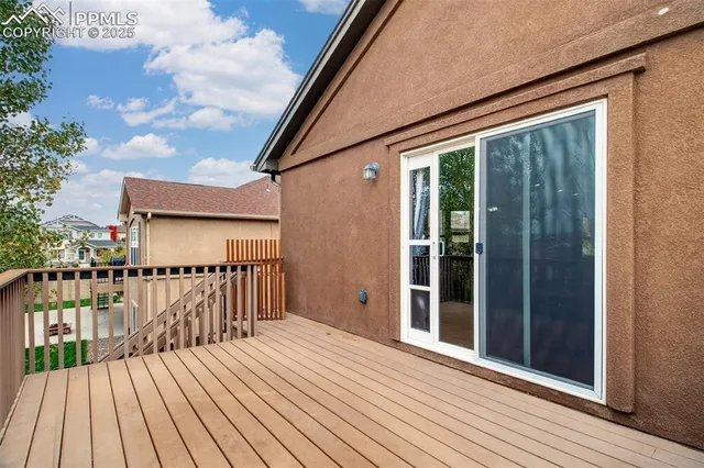 a view of a balcony with wooden floor