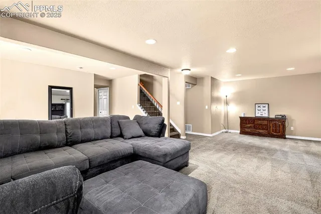 a living room with furniture and a couch