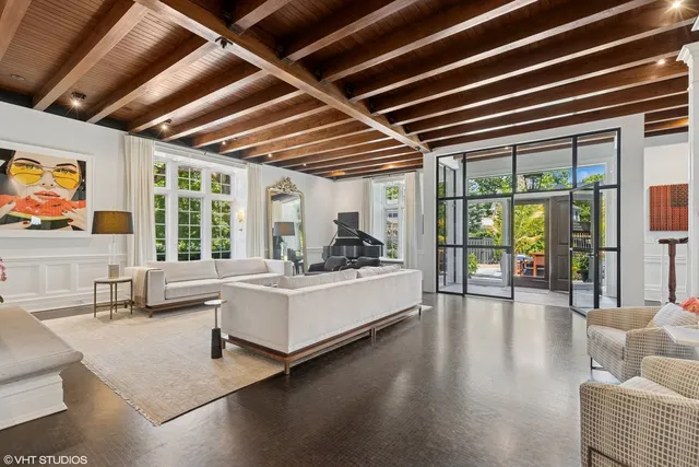 a dining room with furniture and wooden floor