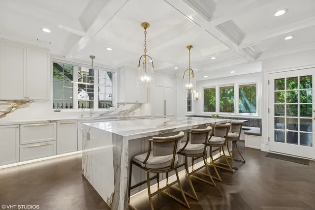a kitchen with stainless steel appliances a sink and a window