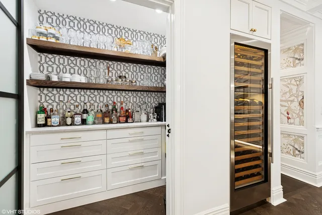 a bedroom with furniture and a large window