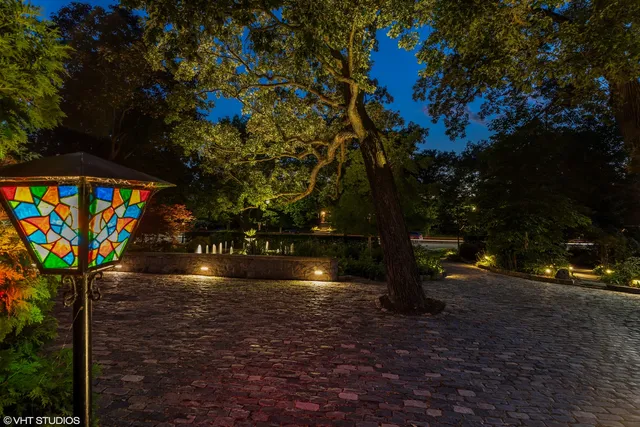 a view of a house with swimming pool and sitting area