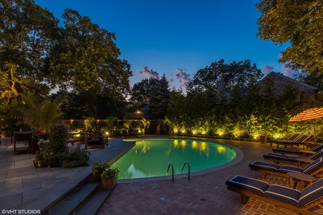 a view of a house with backyard porch and sitting area