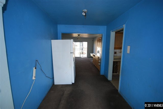 1231 East 9th Street Reno, NV 89512 - Photo 4 of 13 a view of a hallway with wooden shelves