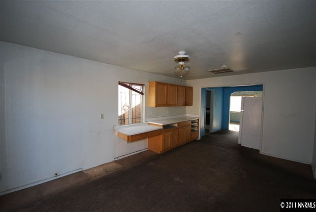 1231 East 9th Street Reno, NV 89512 - Photo 7 of 13 a view of a kitchen with granite countertop sink and cabinets