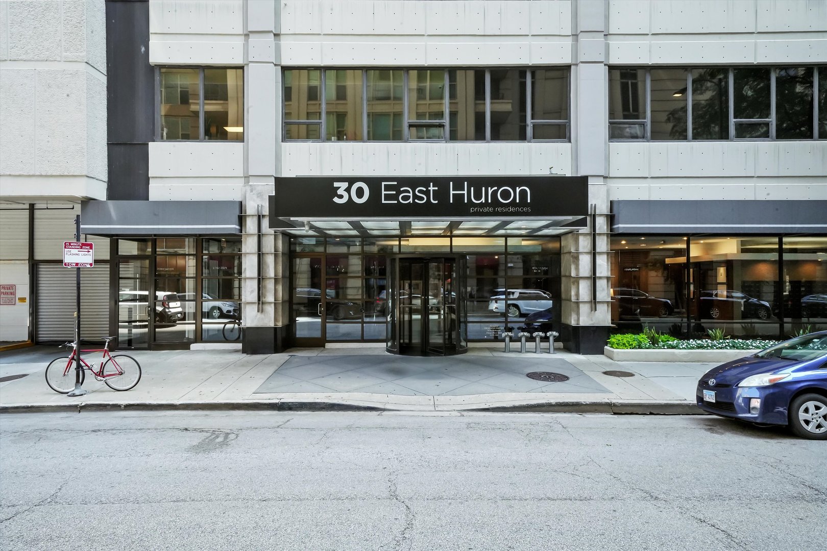 30 East Huron Street, Unit 5410 Chicago, IL 60611 - Photo 27 of 28 a couple of cars parked in front of building