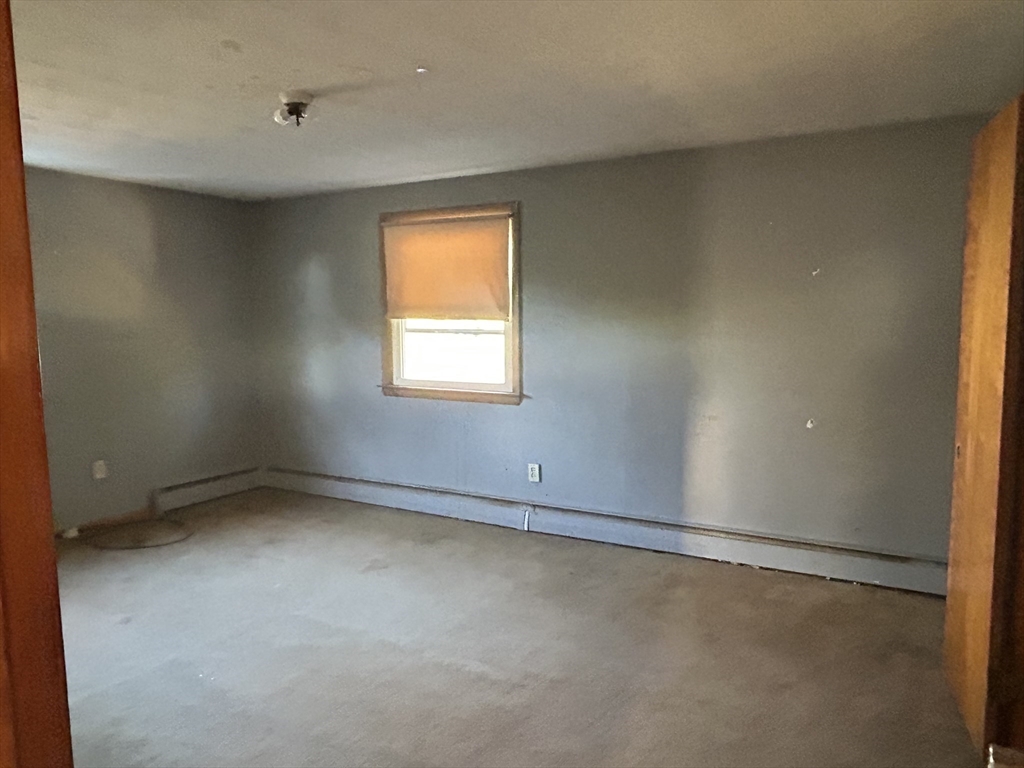 286 Westfield Road Holyoke, MA 01040 - Photo 16 of 26 an empty room with a window