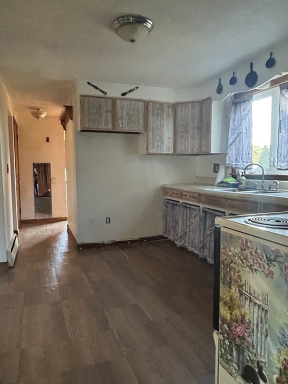 286 Westfield Road Holyoke, MA 01040 - Photo 6 of 26 a kitchen with stainless steel appliances granite countertop a sink stove and refrigerator