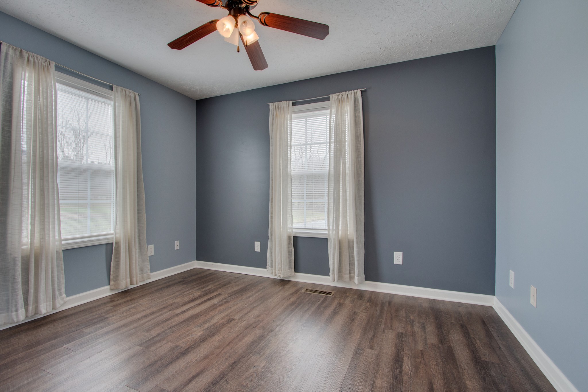 850 North Corinth Road Portland, TN 37148 - Photo 21 of 33 an empty room with wooden floor and windows
