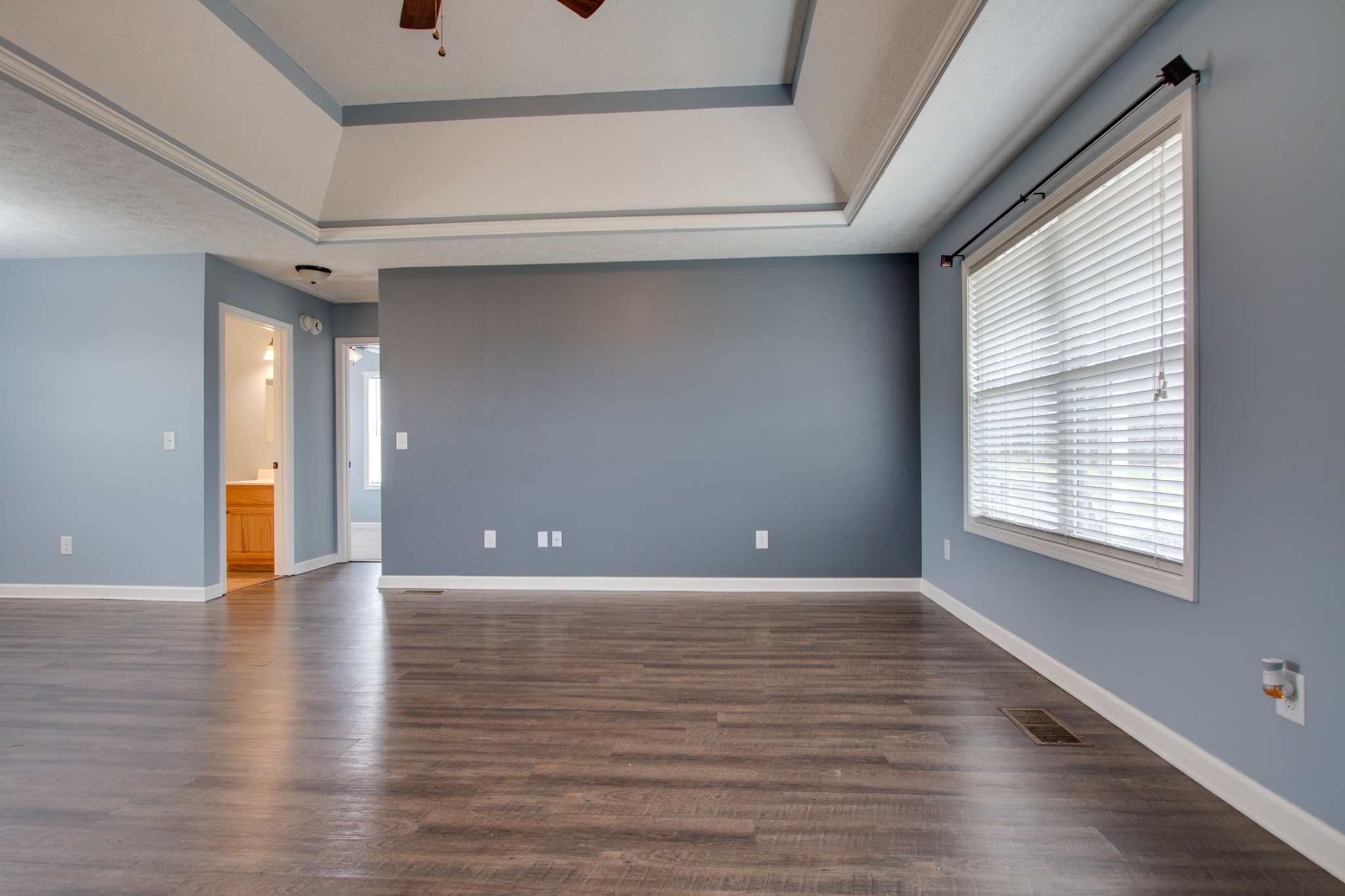 850 North Corinth Road Portland, TN 37148 - Photo 7 of 33 a view of an empty room with wooden floor and a window