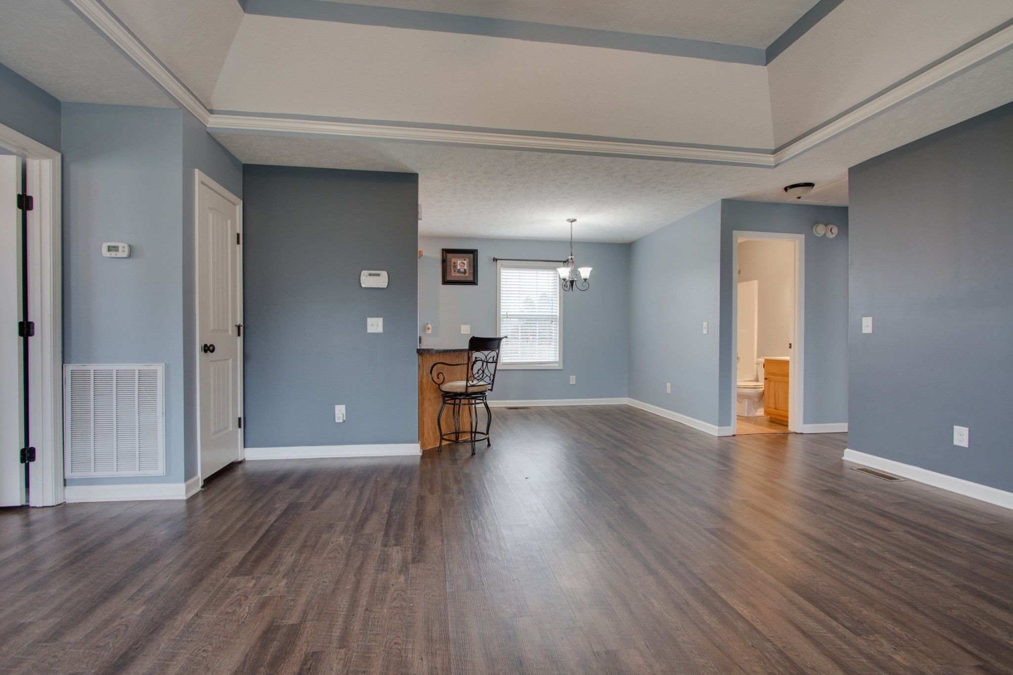 850 North Corinth Road Portland, TN 37148 - Photo 8 of 33 a view of an empty room with wooden floor and a window