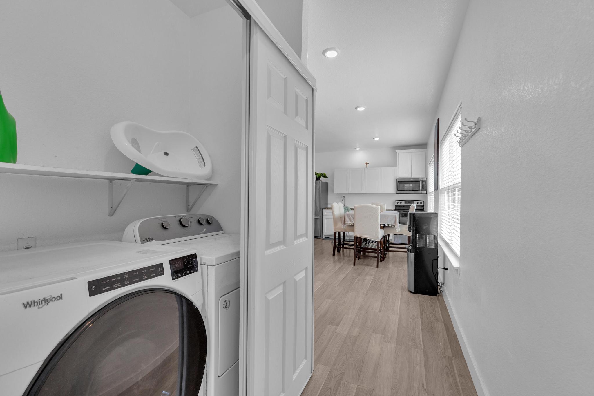 114 Crepe Myrtle Parkway Elgin, TX 78621 - Photo 29 of 40 Unit B - Laundry area with washer and dryer, light wood finished floors, and recessed lighting