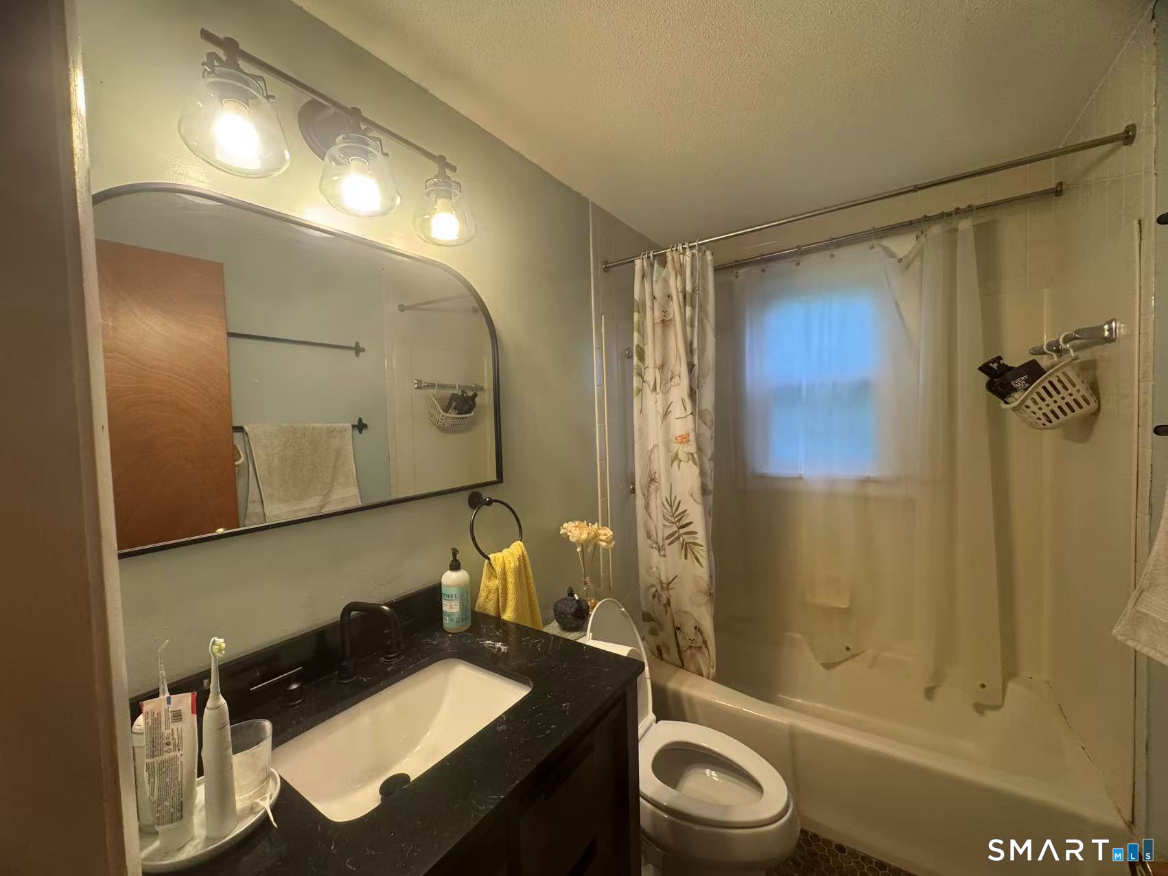 1122 Fienemann Road Farmington, CT 06032 - Photo 14 of 26 a bathroom with a sink a toilet and shower