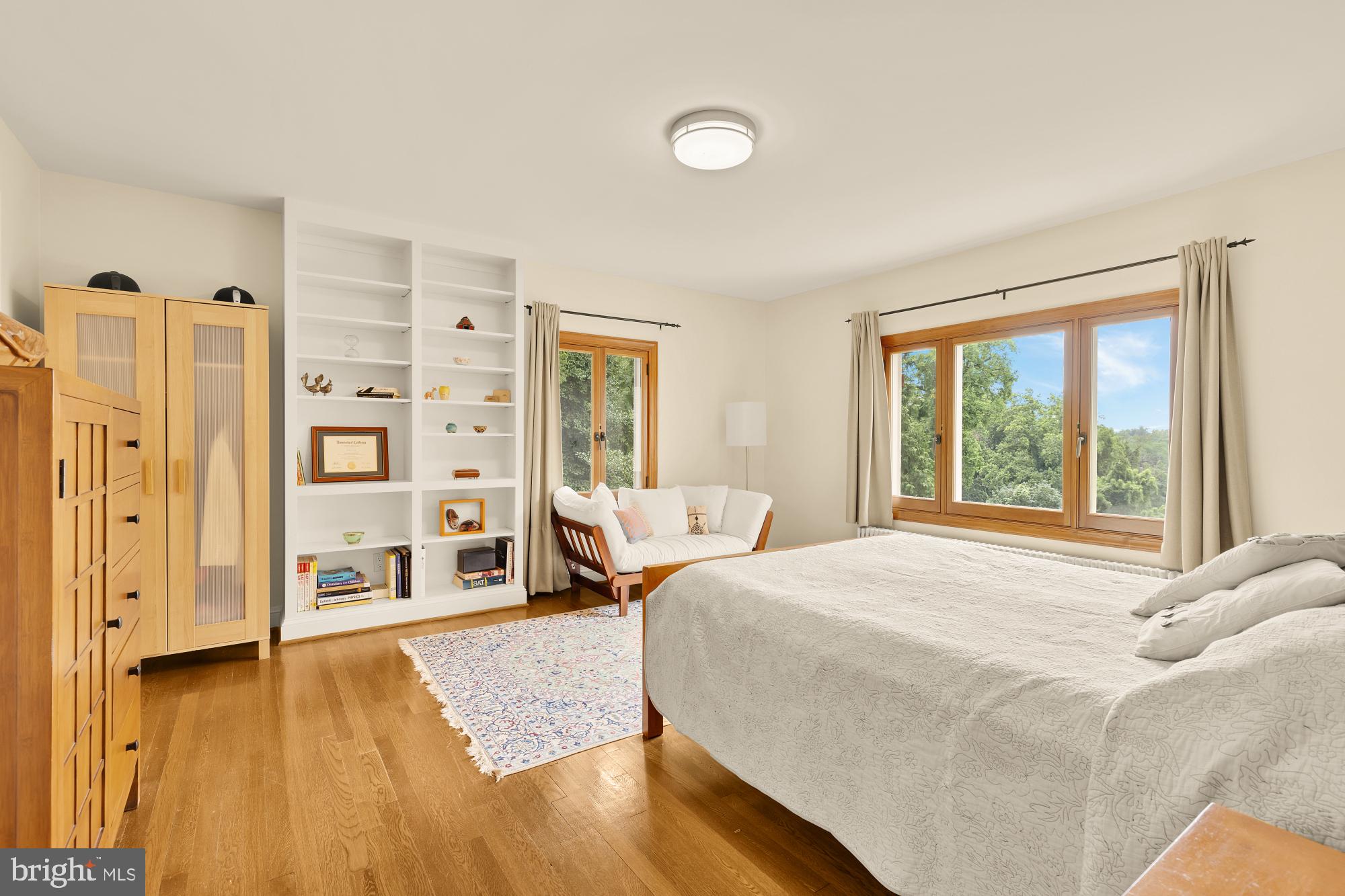 3111 Chain Bridge Road Northwest Washington, DC 20016 - Photo 53 of 71 a bedroom with a bed and wooden floor