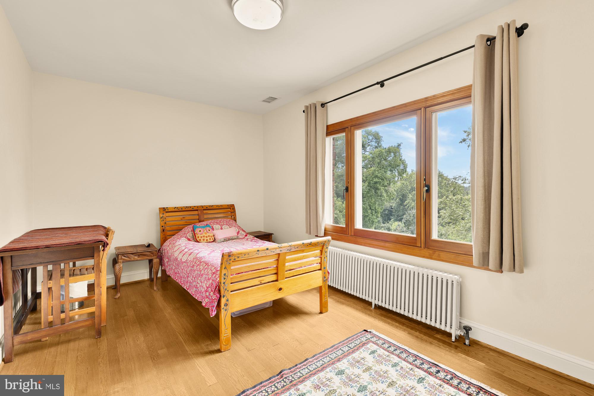3111 Chain Bridge Road Northwest Washington, DC 20016 - Photo 54 of 71 a bedroom with a bed and a large window