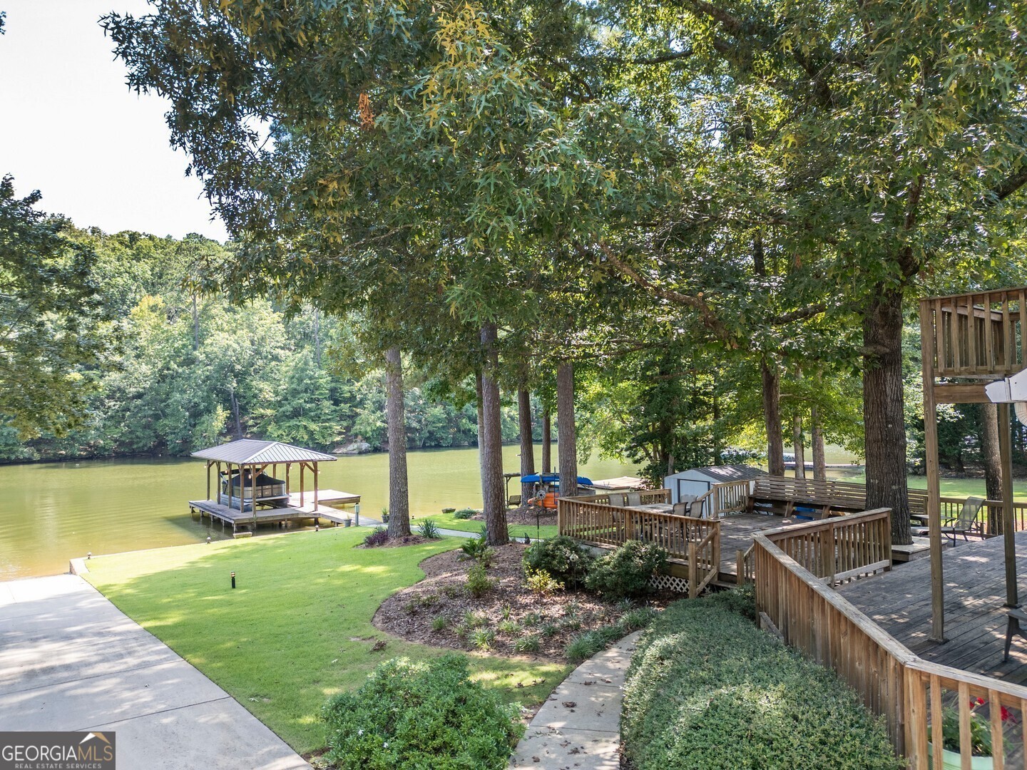2601 Turtle Cove Monticello, GA 31064 - Photo 11 of 85 a view of a house with garden and trees