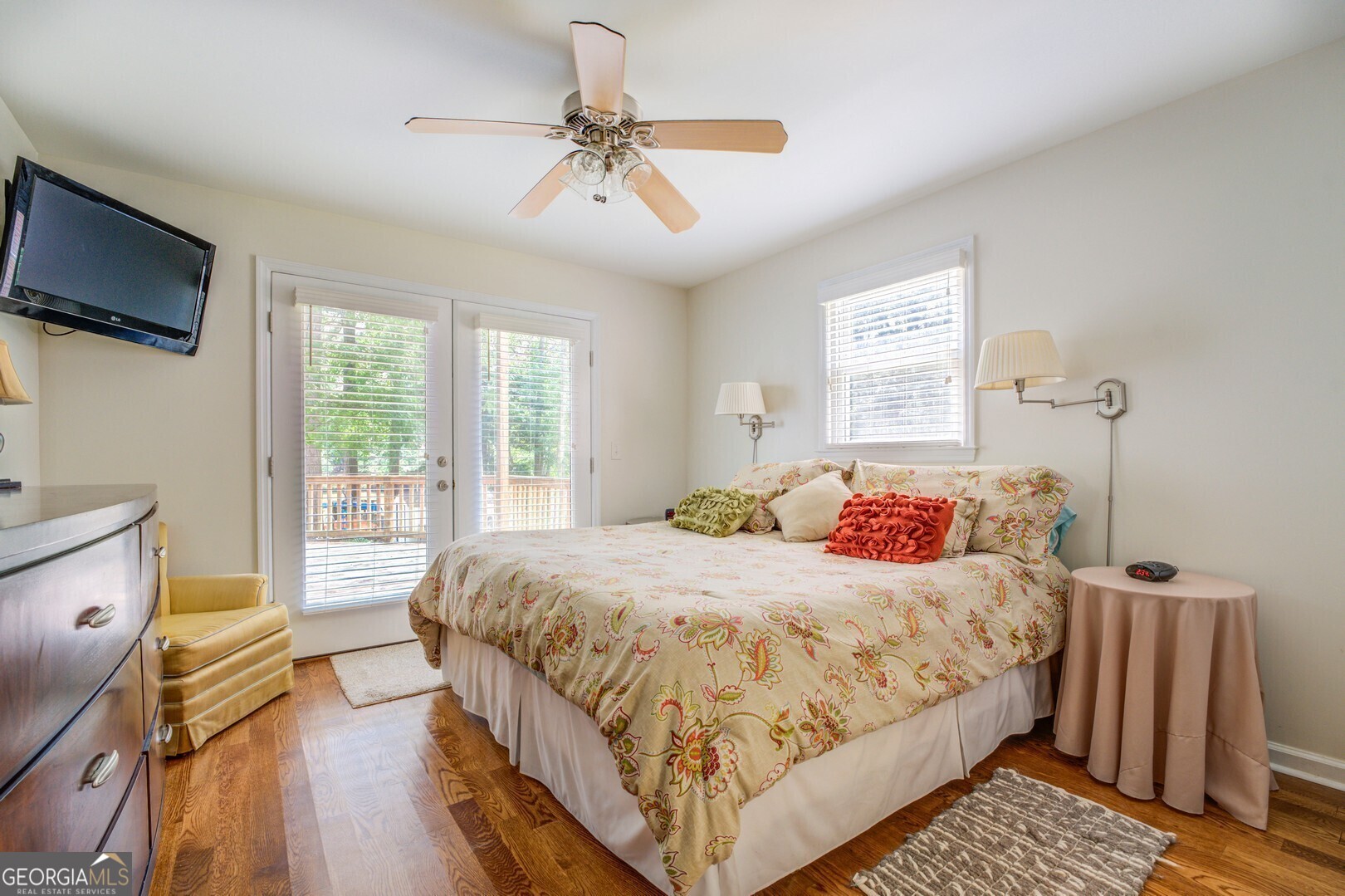 2601 Turtle Cove Monticello, GA 31064 - Photo 23 of 85 a bedroom with a bed a flat screen tv and a large window with the outer view