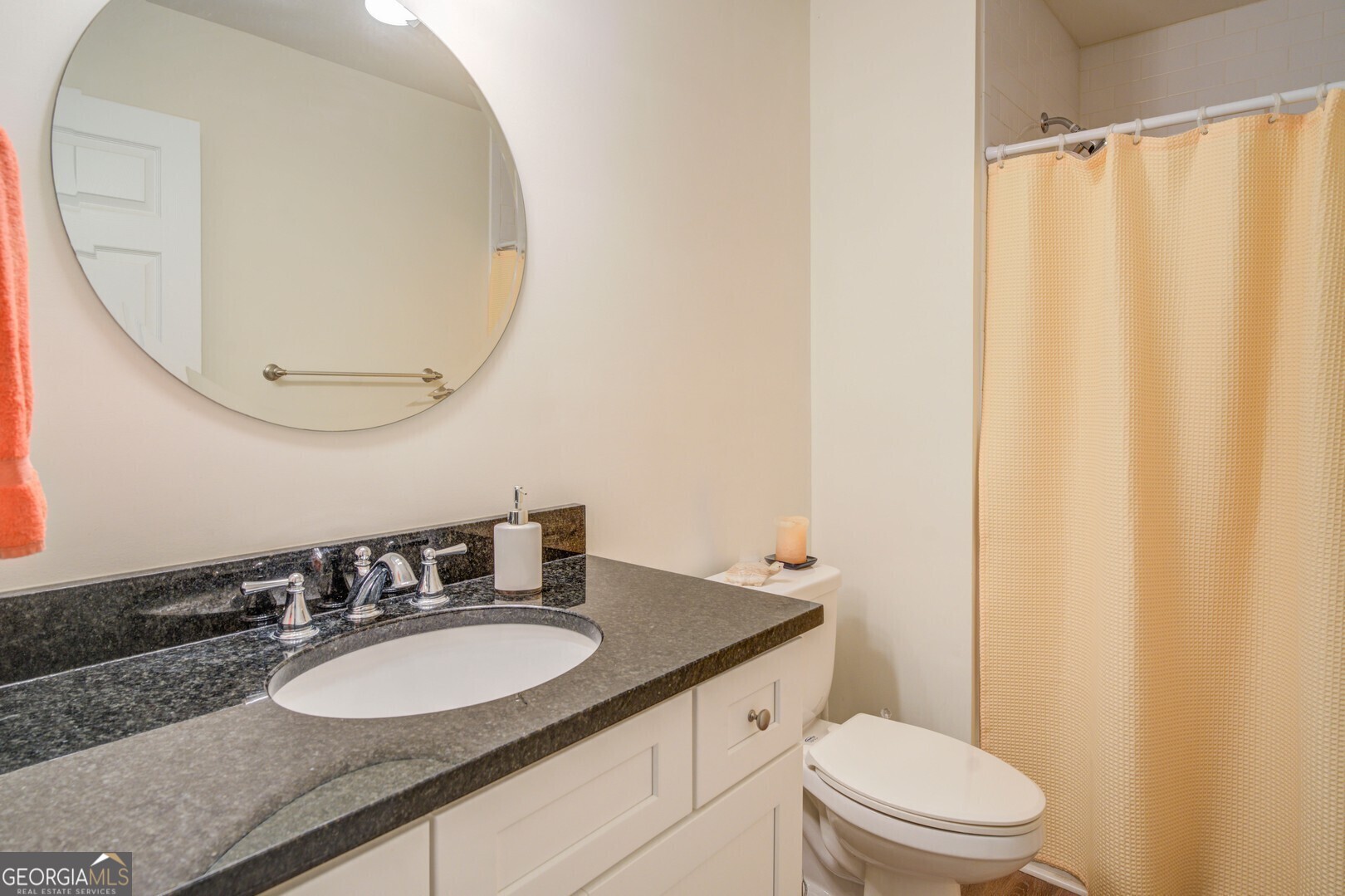 2601 Turtle Cove Monticello, GA 31064 - Photo 28 of 85 a bathroom with a granite countertop sink and a mirror