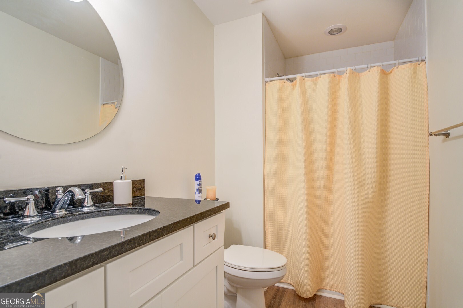 2601 Turtle Cove Monticello, GA 31064 - Photo 29 of 85 a bathroom with a granite countertop sink and a mirror