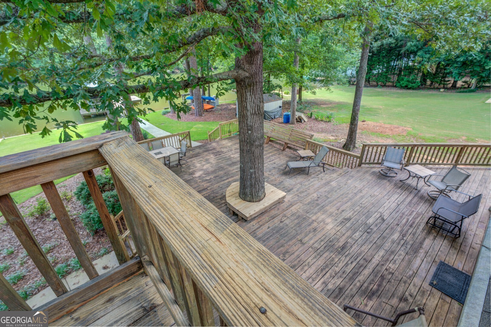 2601 Turtle Cove Monticello, GA 31064 - Photo 39 of 85 a view of a deck with a big yard potted plants and large tree