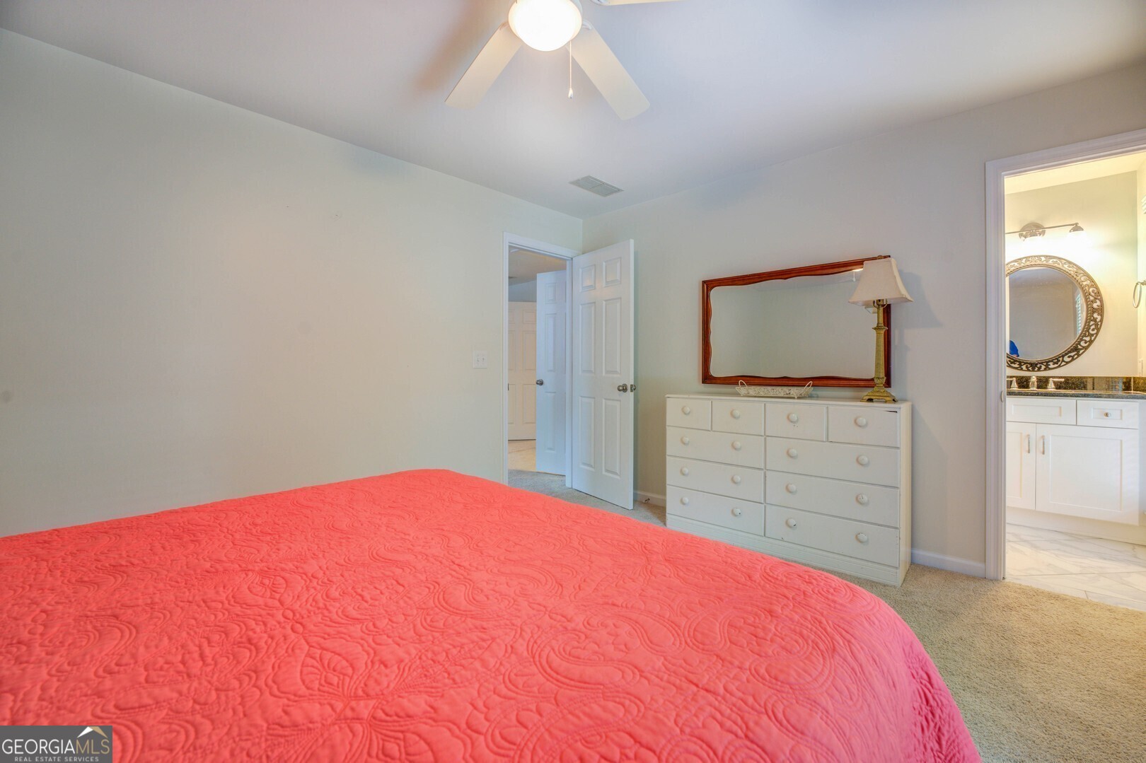 2601 Turtle Cove Monticello, GA 31064 - Photo 42 of 85 a bedroom with a bed and a flat screen tv in white walls