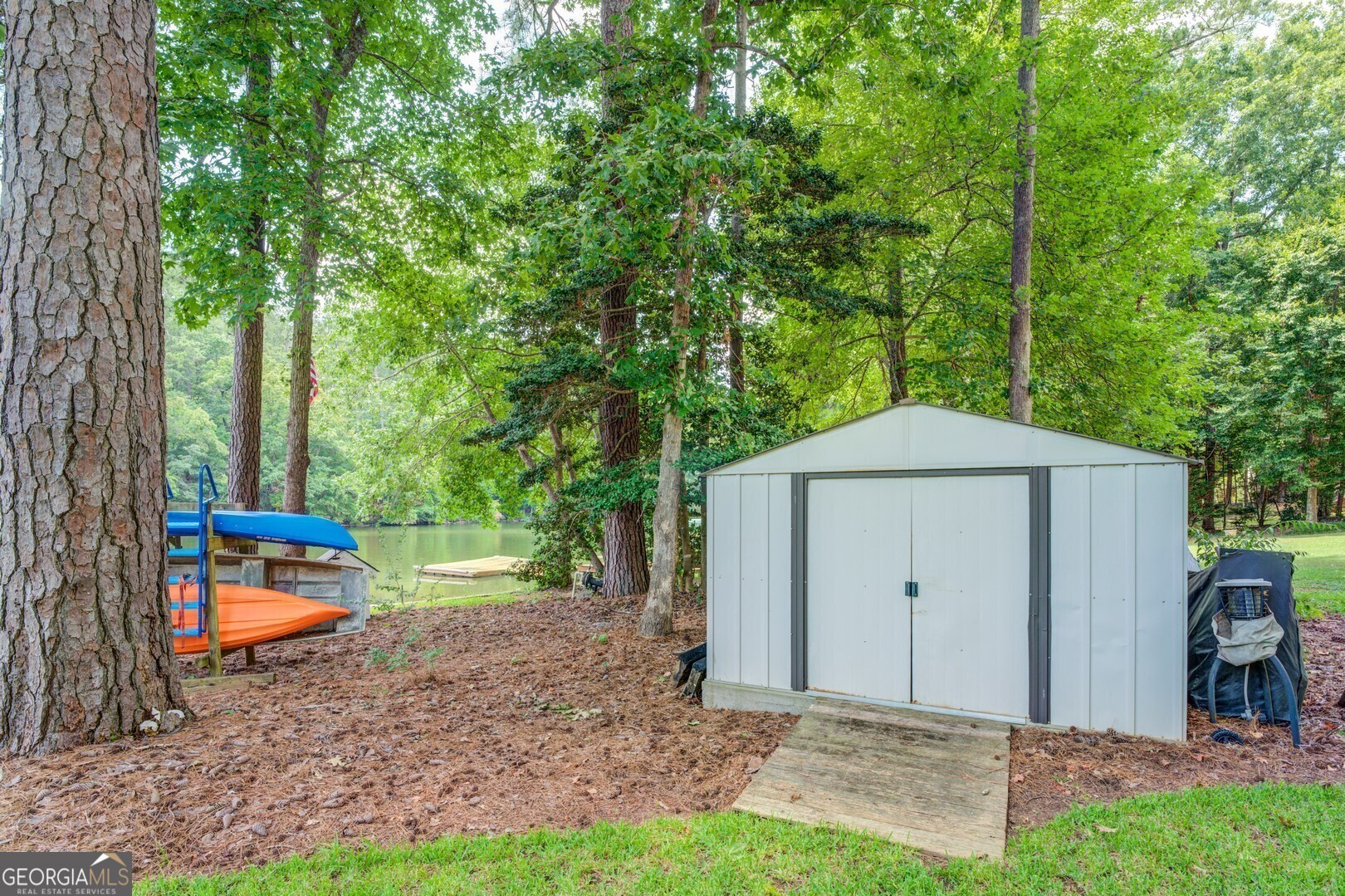 2601 Turtle Cove Monticello, GA 31064 - Photo 57 of 85 a backyard of a house with table and chairs
