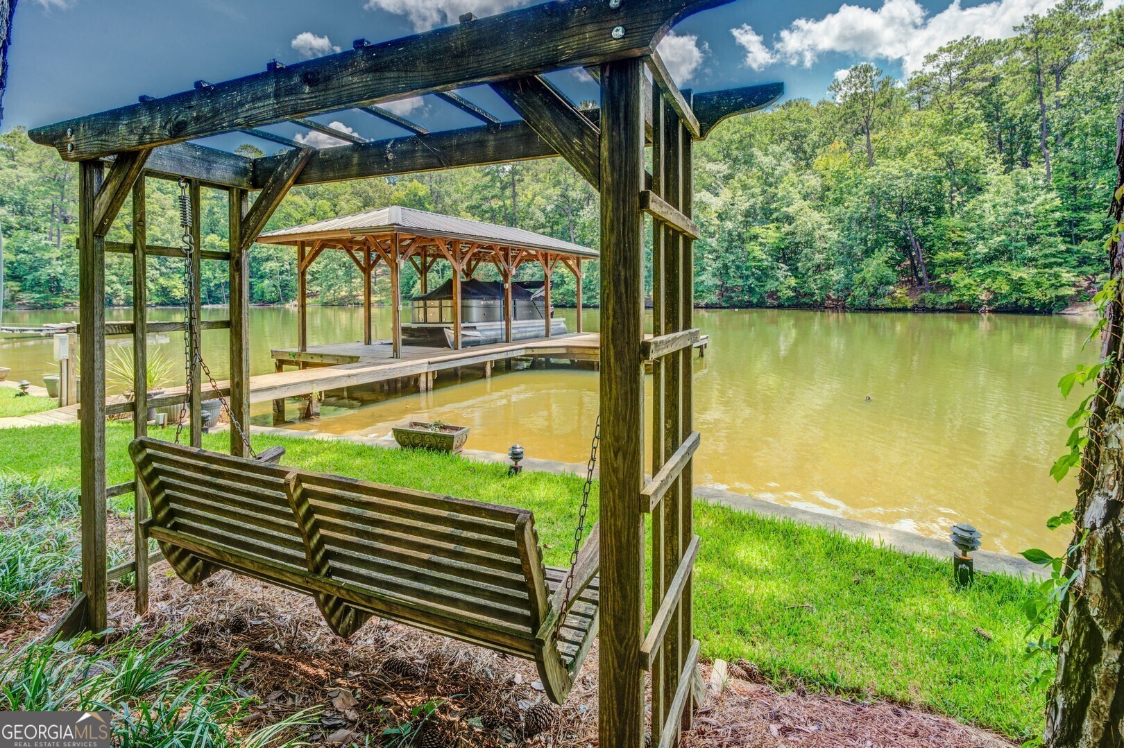 2601 Turtle Cove Monticello, GA 31064 - Photo 61 of 85 a view of a swimming pool with a porch and furniture