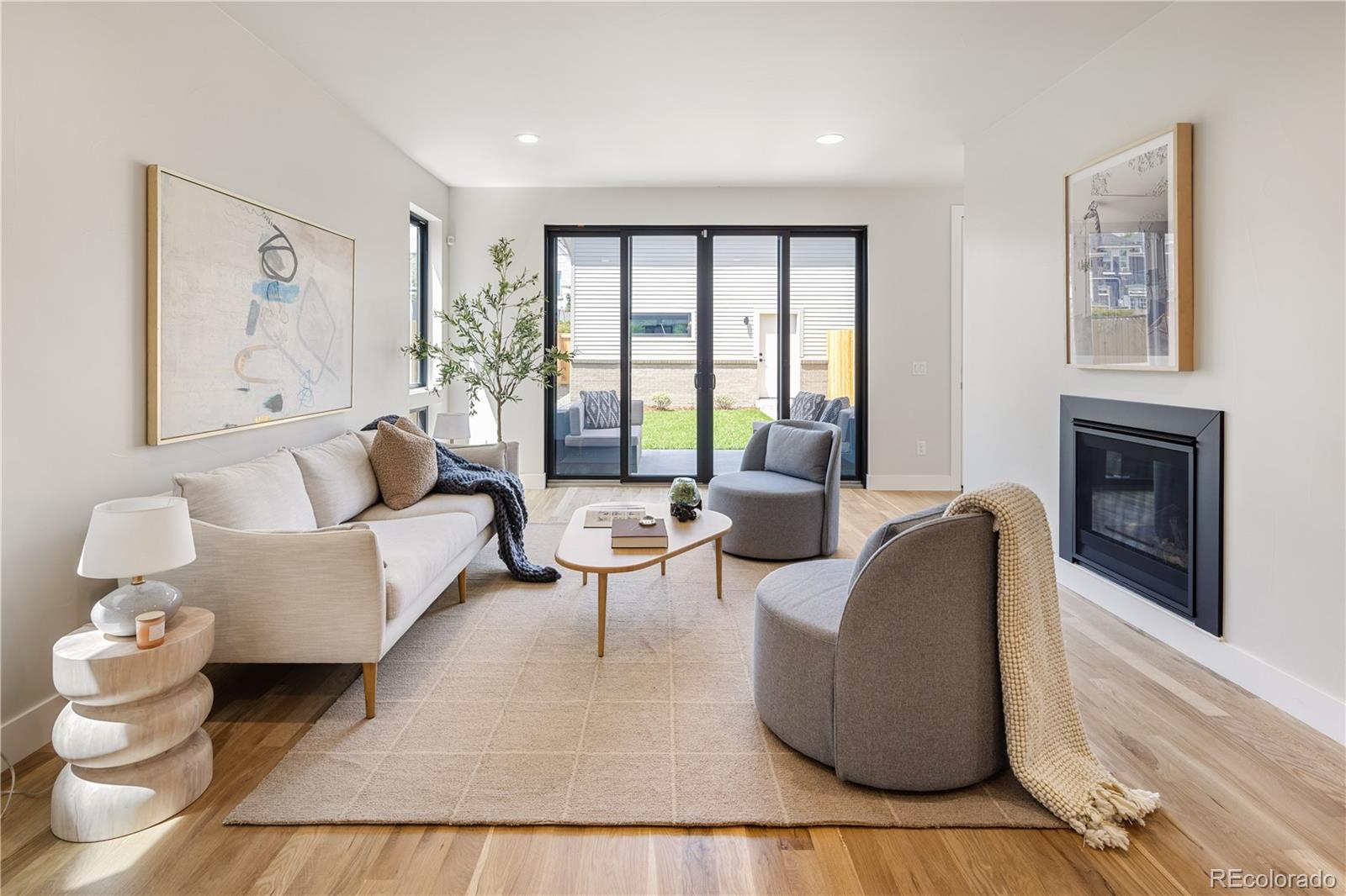2143 High Street Denver, CO 80205 - Photo 12 of 43 a living room with furniture and a fireplace