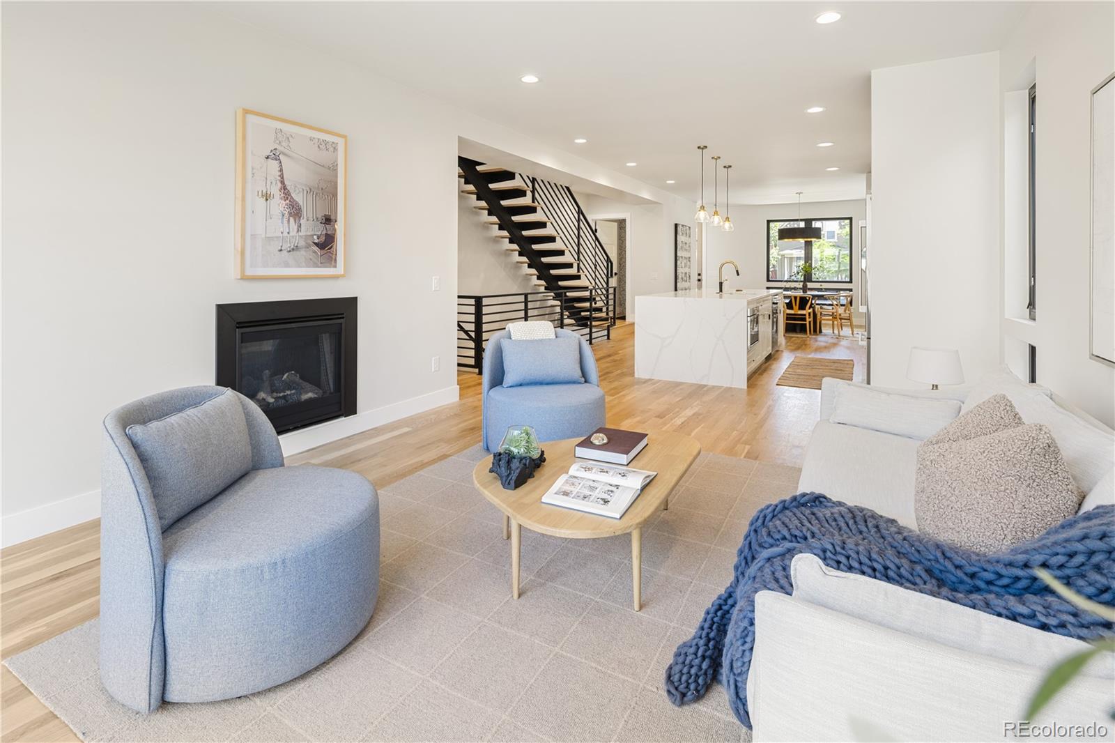 2143 High Street Denver, CO 80205 - Photo 14 of 43 a living room with furniture and a fireplace