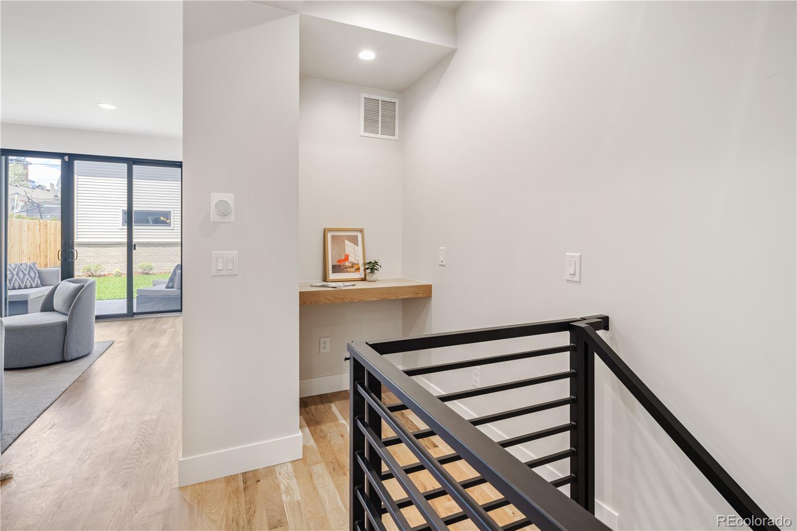 2143 High Street Denver, CO 80205 - Photo 29 of 43 a view of entryway with wooden floor and a rug
