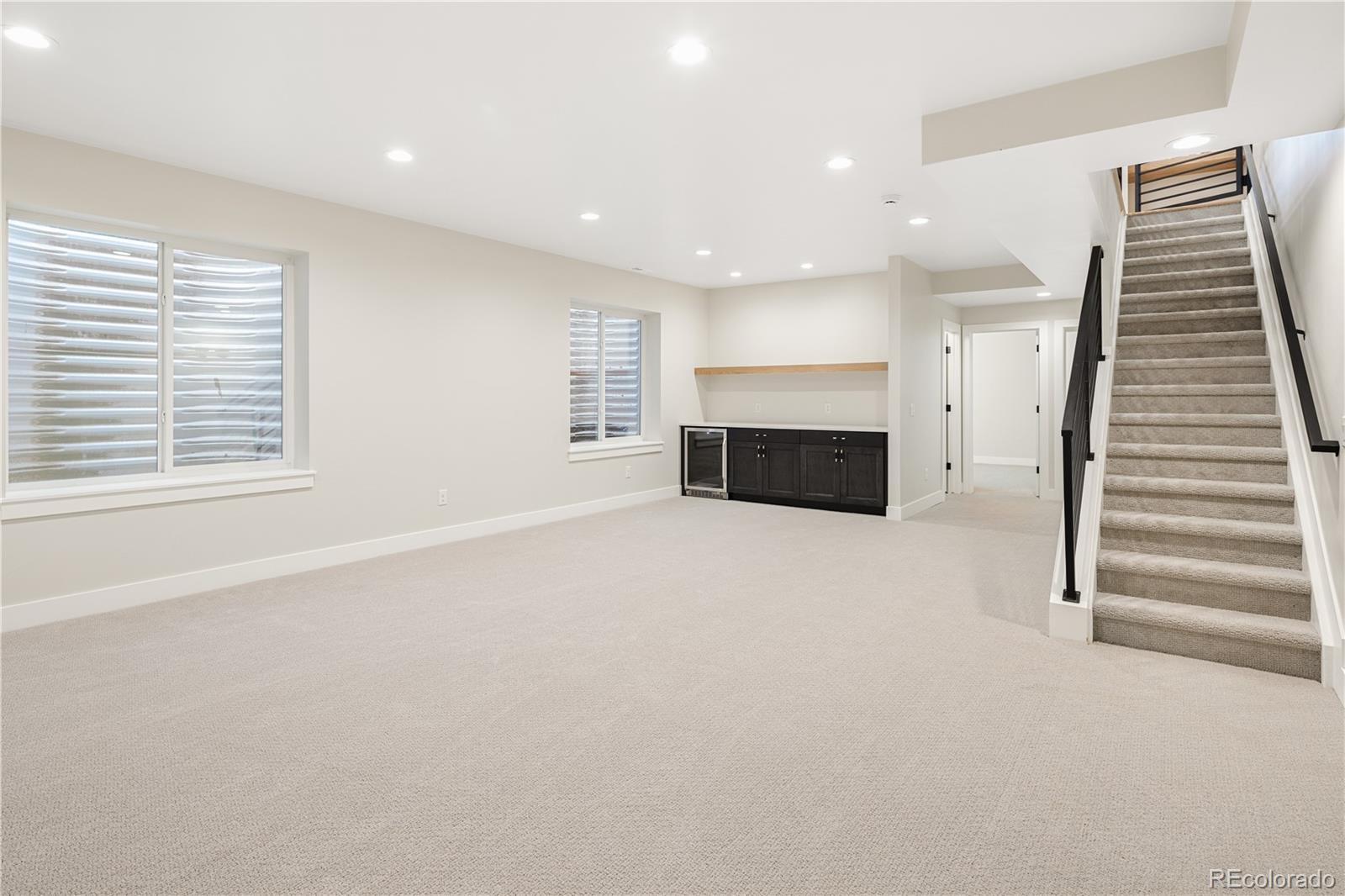 2143 High Street Denver, CO 80205 - Photo 30 of 43 an empty room with fireplace and windows