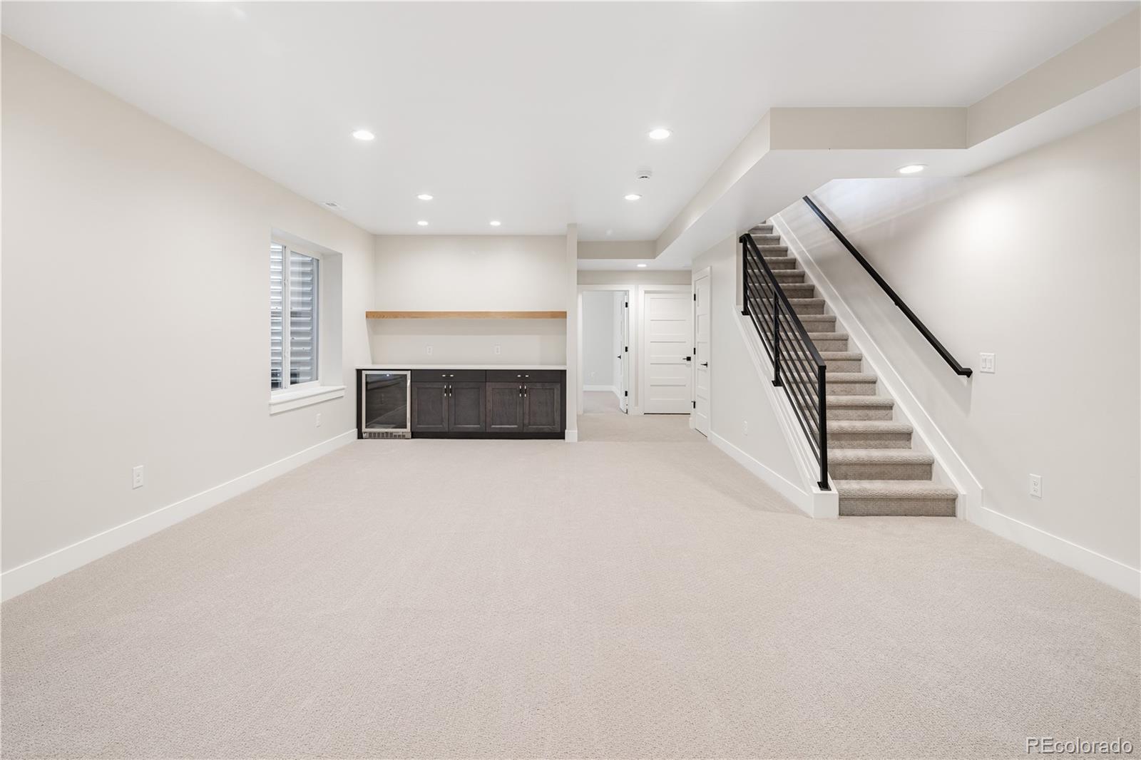 2143 High Street Denver, CO 80205 - Photo 31 of 43 an empty room with furniture and a fireplace