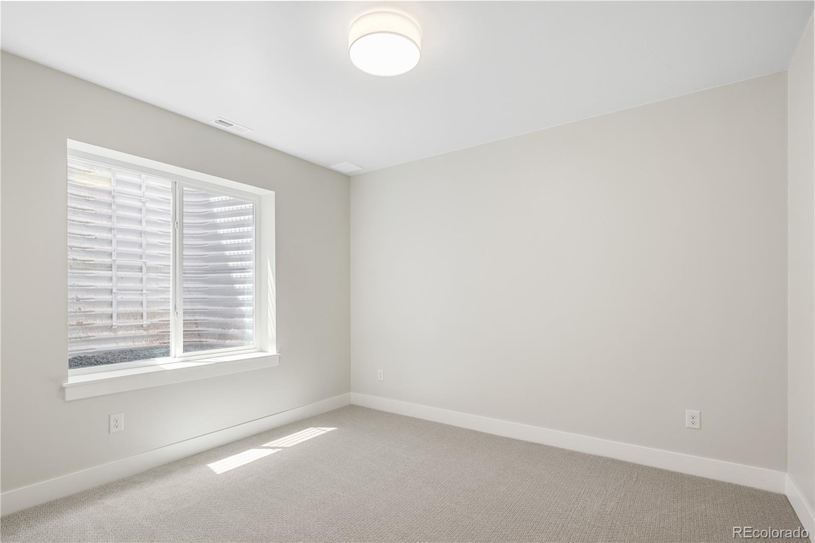 2143 High Street Denver, CO 80205 - Photo 34 of 43 a view of an empty room with a window